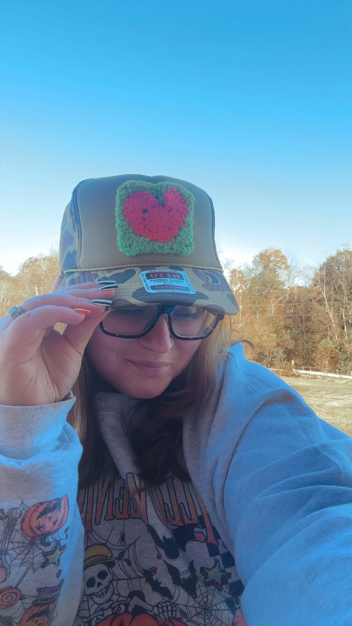Camo Bill Trucker Hat with Orange Heart Crochet Patch