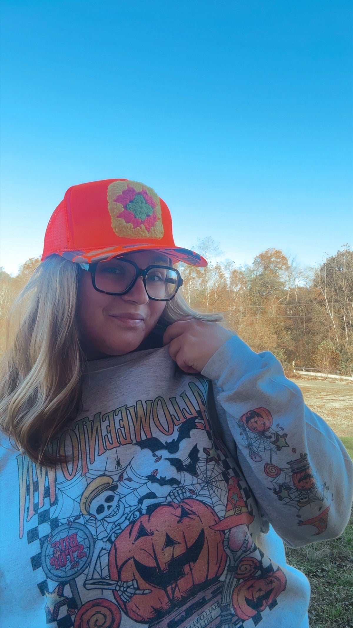 Neon Orange Camo Bill Trucker Hat with Colorful Crochet Patch